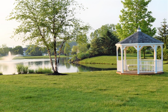 exterior space with a gazebo and a water view