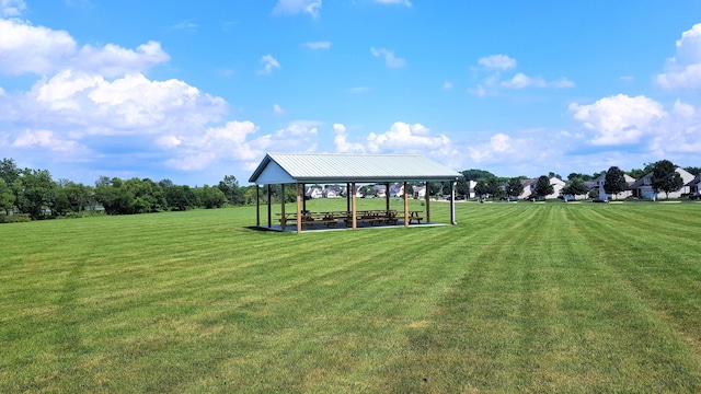 view of property's community with a gazebo and a lawn