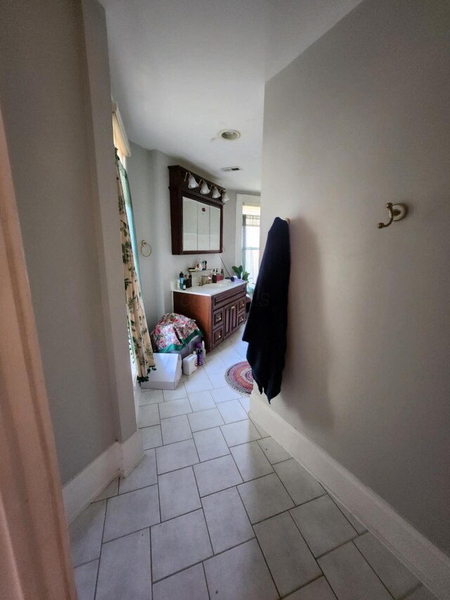 bathroom with vanity and tile patterned floors