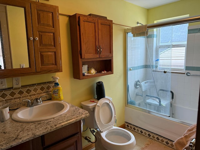 full bathroom featuring backsplash, toilet, vanity, and combined bath / shower with glass door