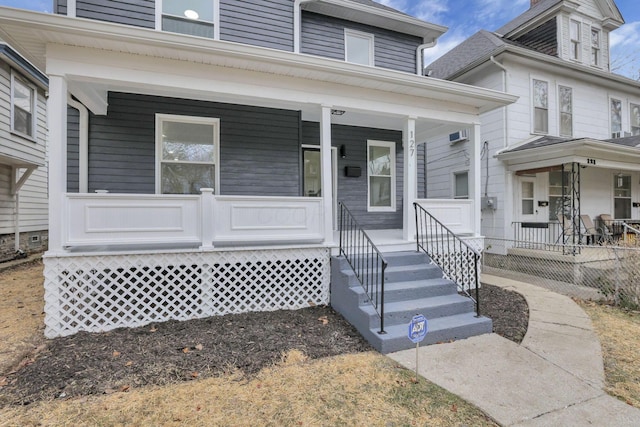 property entrance featuring covered porch