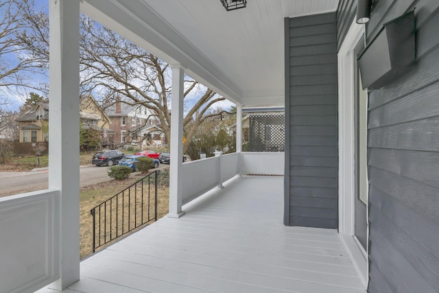 wooden terrace featuring a porch