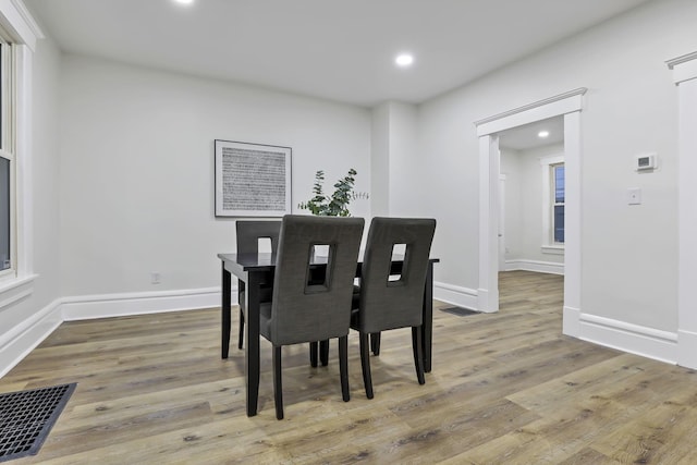 dining room with wood-type flooring