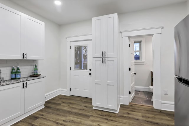 entryway with dark hardwood / wood-style floors