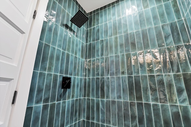 bathroom with tiled shower