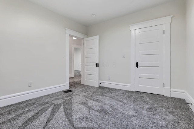 unfurnished bedroom featuring carpet floors