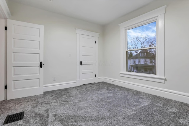 unfurnished room with carpet floors