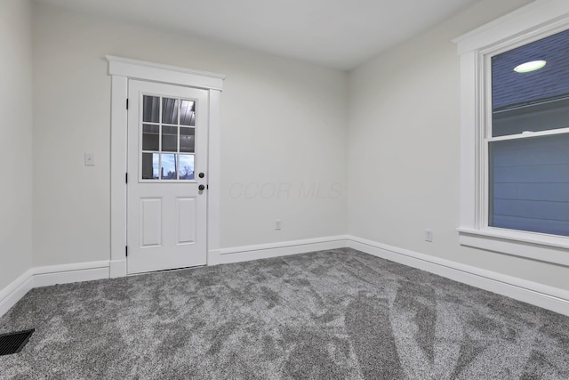 unfurnished room with carpet floors