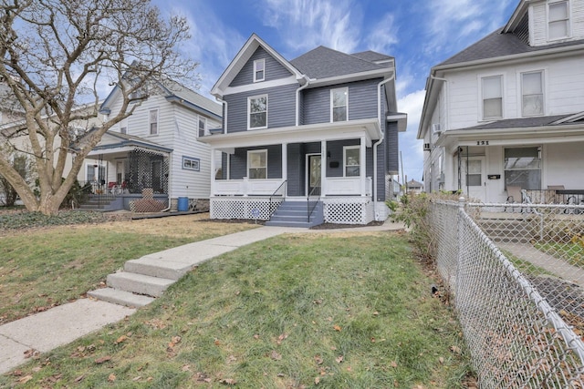 front facade with a front lawn and a porch