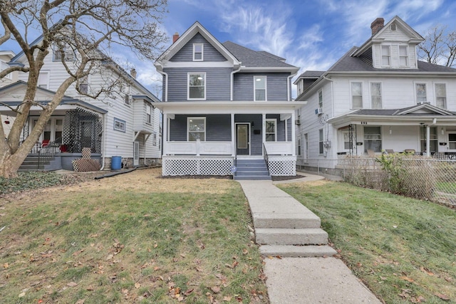 view of front of home featuring a porch and a front yard