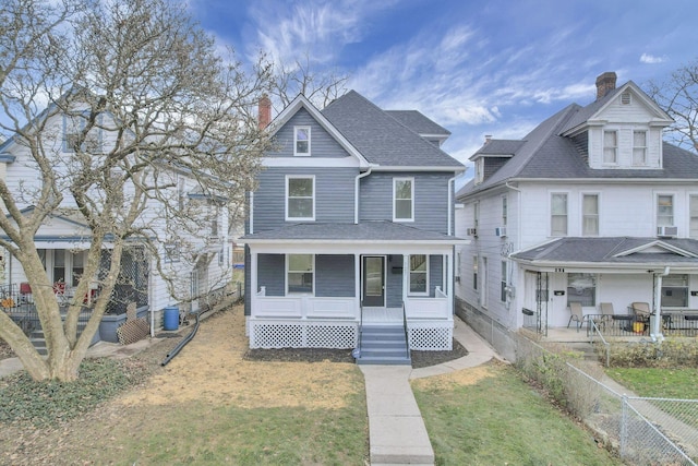 view of front of property with cooling unit and covered porch