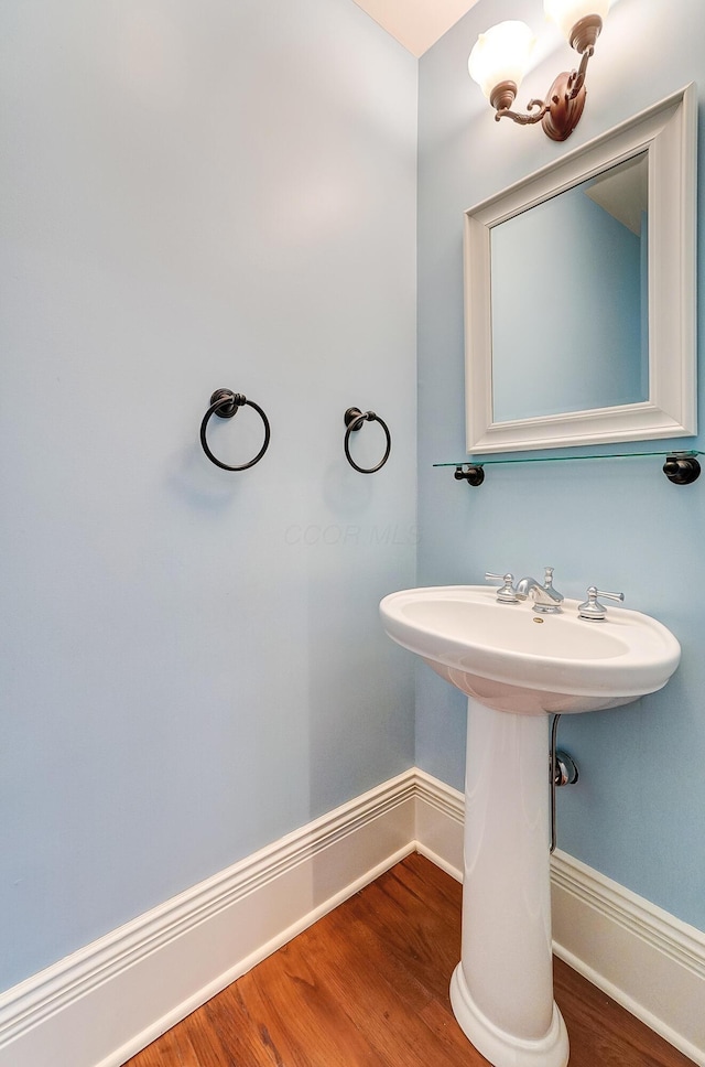 bathroom featuring sink and hardwood / wood-style flooring