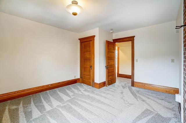 unfurnished bedroom featuring light colored carpet