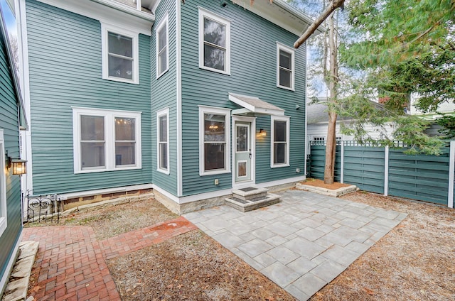 back of house with a patio area