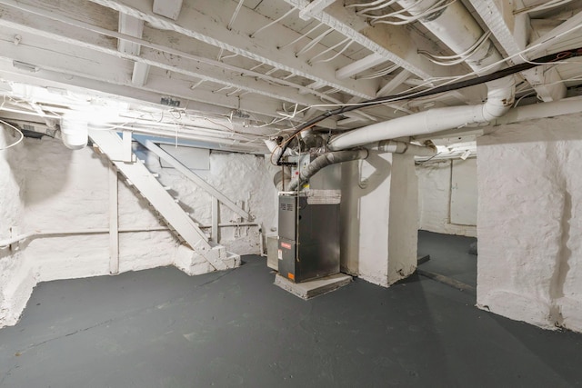 basement featuring heating unit