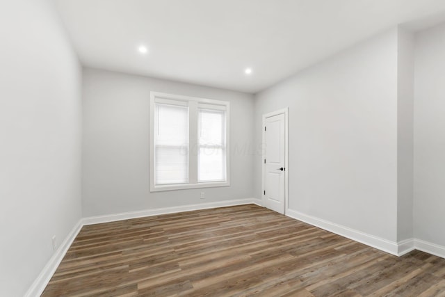 spare room featuring dark hardwood / wood-style floors