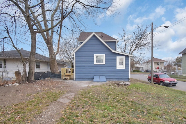 view of property exterior with a lawn