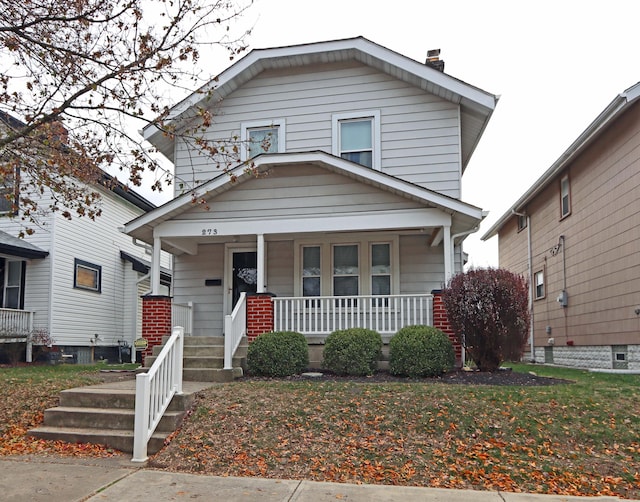 view of front of home with a front yard