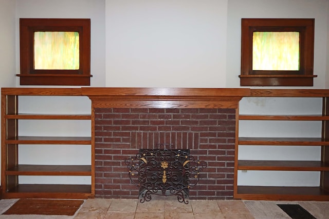 room details featuring a brick fireplace