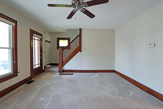 interior space featuring ceiling fan and a healthy amount of sunlight