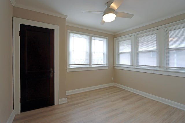 interior space with ceiling fan, light hardwood / wood-style floors, and crown molding