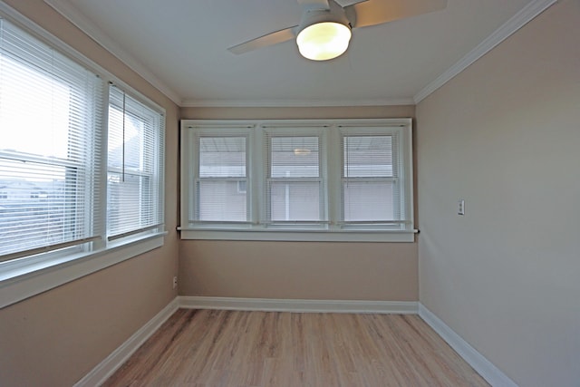 unfurnished sunroom featuring ceiling fan