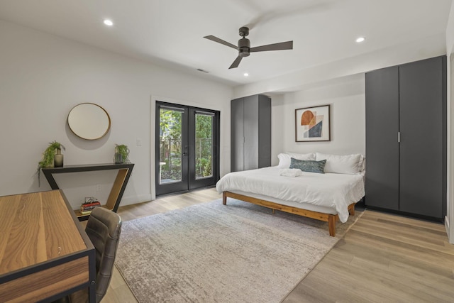 bedroom with access to outside, ceiling fan, french doors, and light wood-type flooring