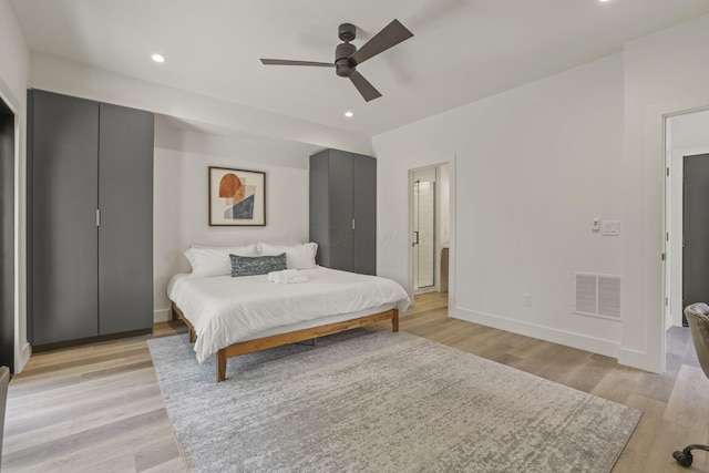 bedroom featuring ceiling fan and light hardwood / wood-style flooring