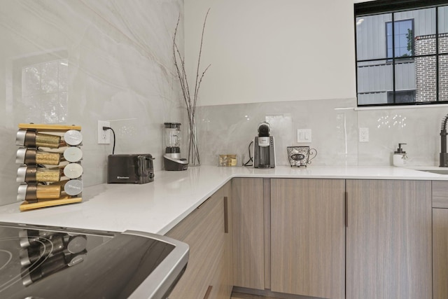 kitchen featuring backsplash and stainless steel range