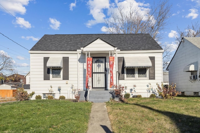 bungalow-style house featuring a front lawn