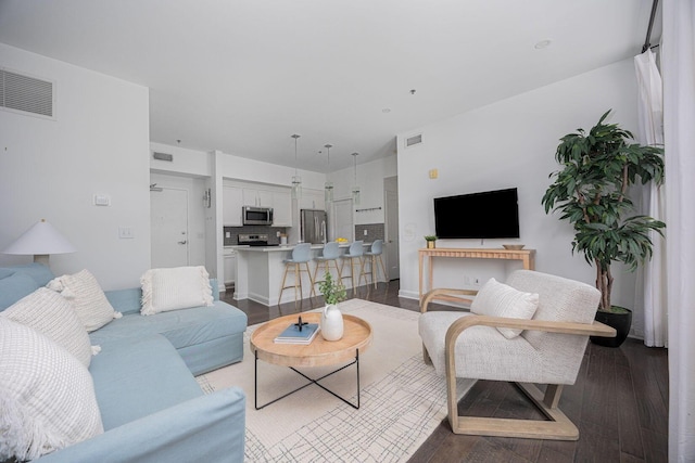 living room with dark wood-type flooring