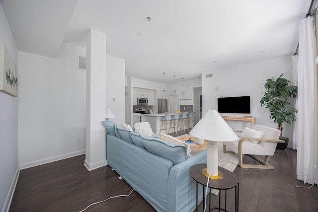 living room featuring dark wood-type flooring