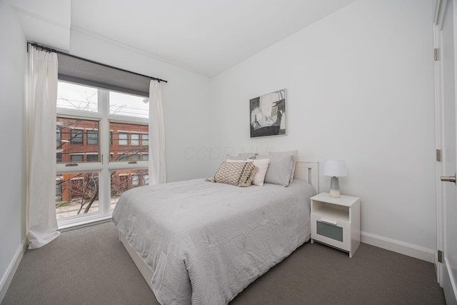 bedroom featuring dark colored carpet