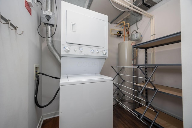 laundry area with stacked washer / drying machine and dark hardwood / wood-style floors