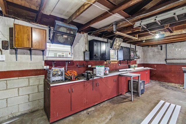 kitchen featuring a wealth of natural light and concrete floors