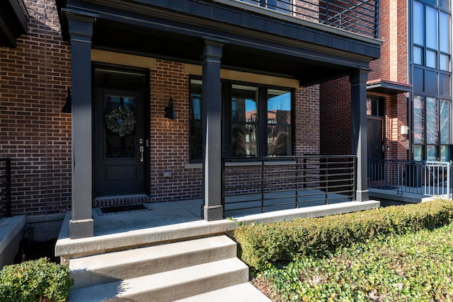 view of exterior entry featuring a porch