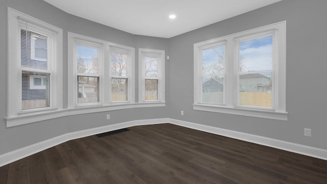 spare room featuring hardwood / wood-style floors