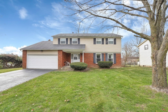 view of front facade with a front yard and a garage