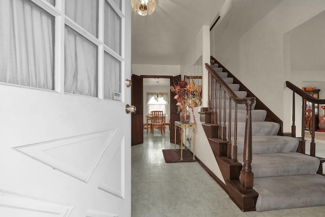 entryway featuring an inviting chandelier