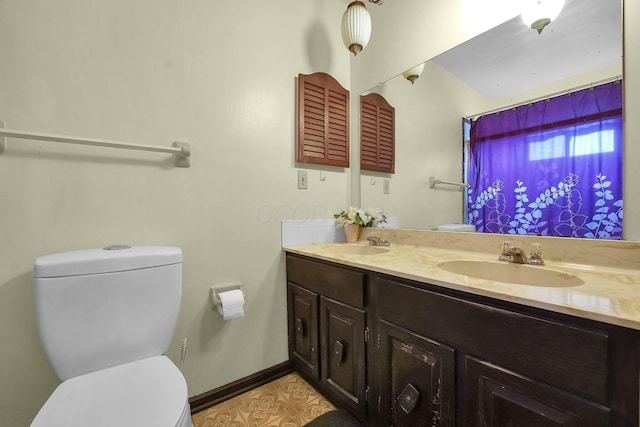 bathroom featuring vanity and toilet