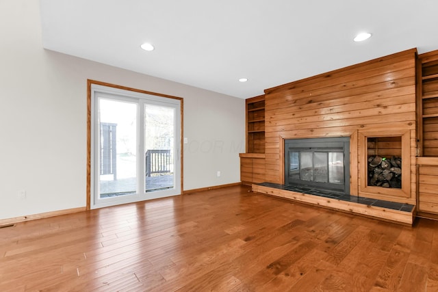 unfurnished living room with hardwood / wood-style flooring