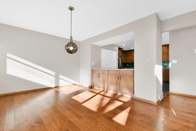 unfurnished living room featuring light hardwood / wood-style floors