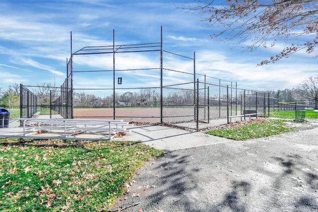 view of community featuring tennis court