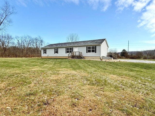 back of house featuring a yard