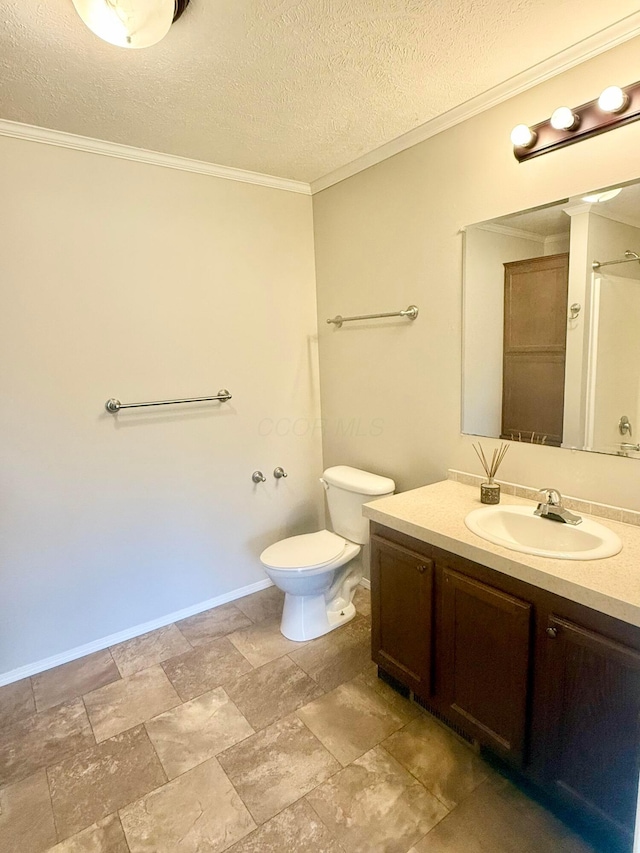 bathroom with vanity, crown molding, toilet, a textured ceiling, and walk in shower