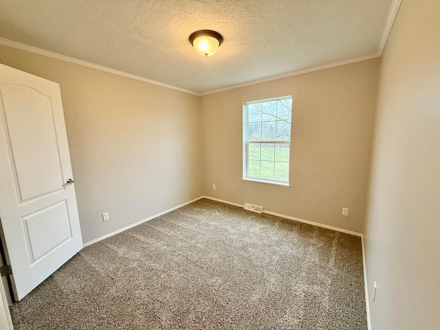 spare room with a textured ceiling, dark carpet, and ornamental molding