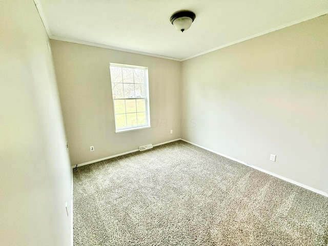 carpeted spare room with ornamental molding