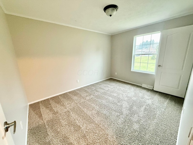 carpeted spare room with ornamental molding