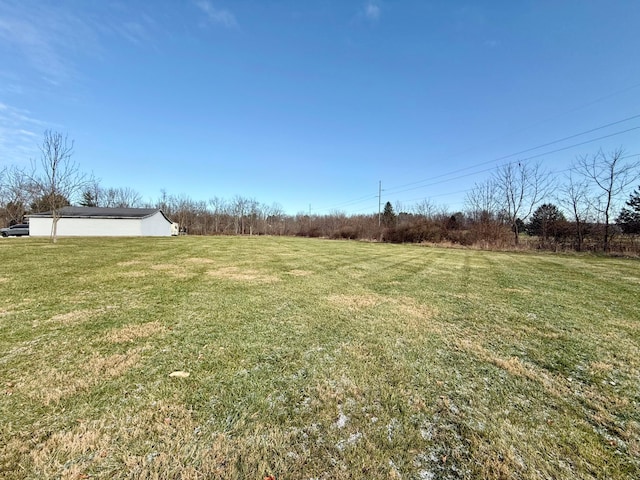 view of yard with a rural view