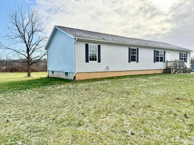 back of property with a lawn